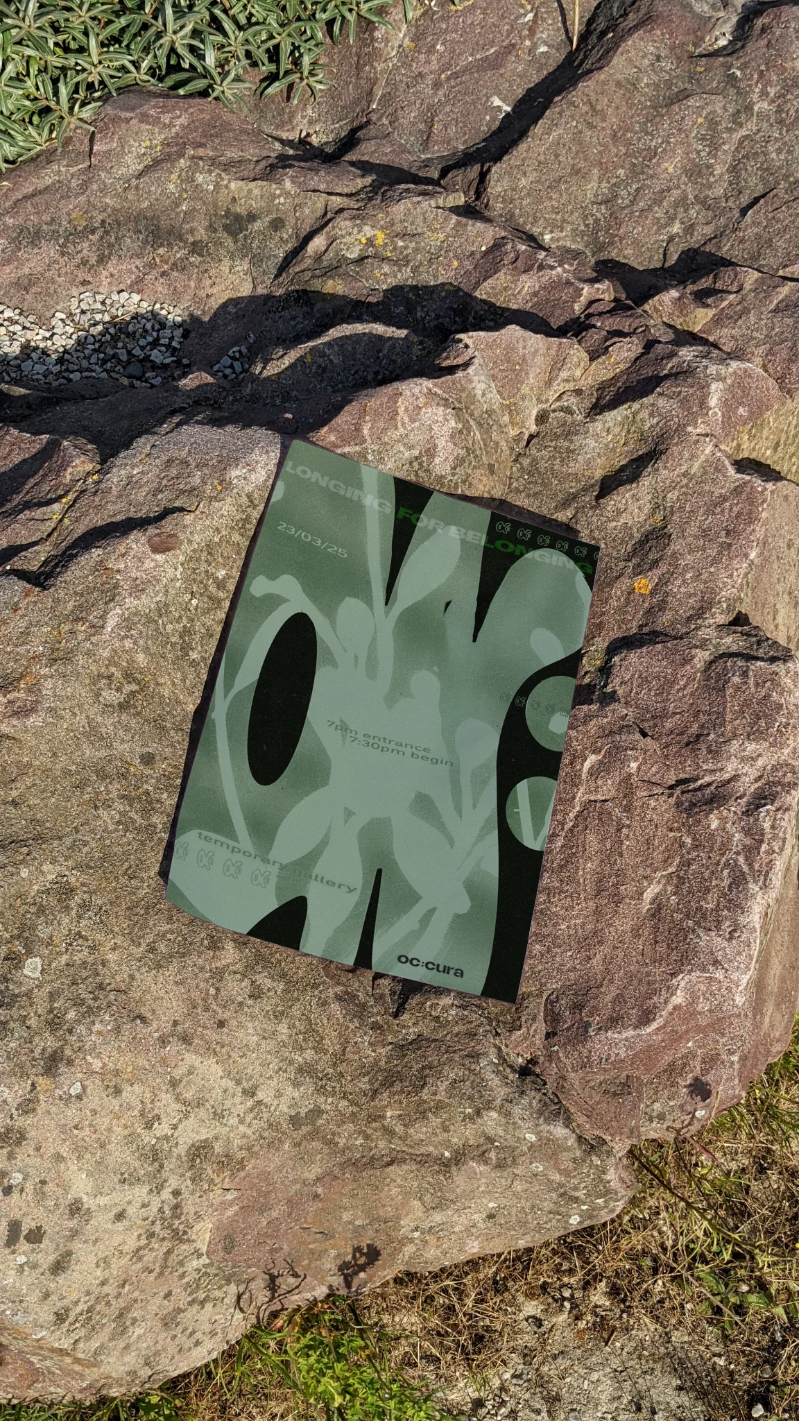 oc:cura poster mockup on rock